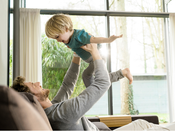 Father and child playing inside